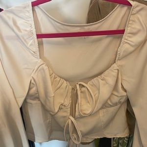 Tie front, cream color, blouse size large.